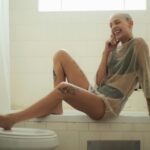 Woman Laughing on Bath Tub