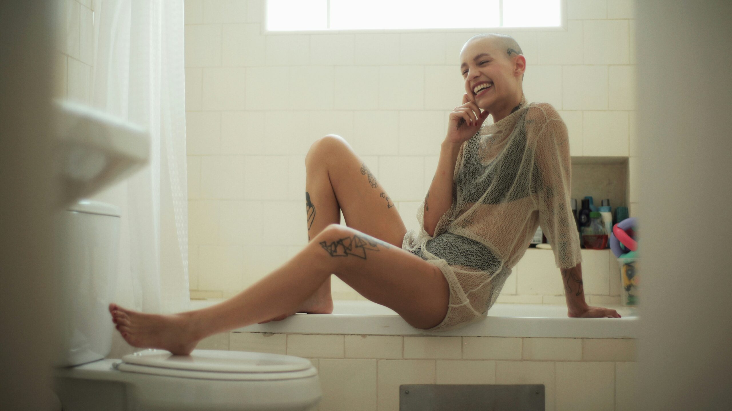 Woman Laughing on Bath Tub